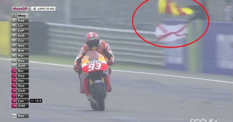 _White Flag with diagonal Red Cross and Yellow & Red Striped Flag motogp